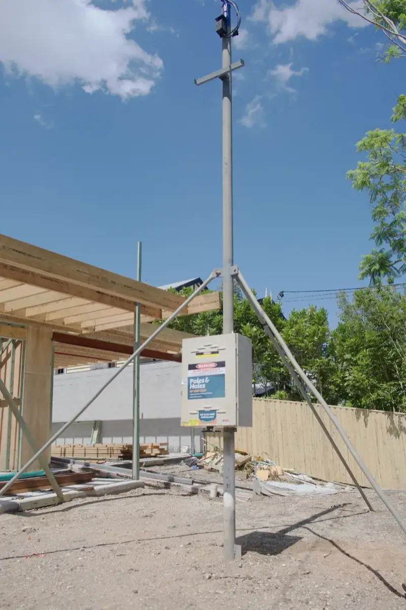Poles and Holes temporary power pole installed at a construction site