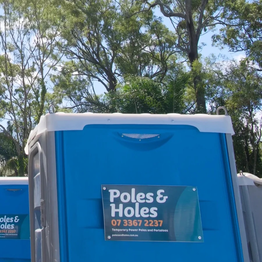 A row of Poles and Holes event portaloos ready to go out