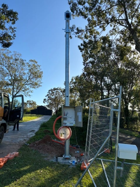 A Poles and Holes permanent galvanised power pole installed on a South East Queensland property