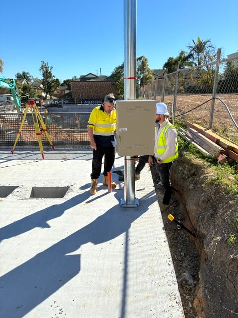 A Poles and Holes permanent galvanised power pole installed on a South East Queensland property