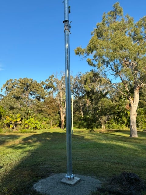 A Poles and Holes permanent galvanised power pole installed on a South East Queensland property