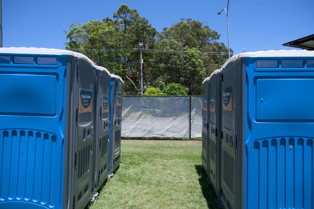 A row of Poles and Holes event portaloos ready for guests